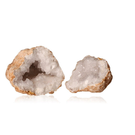 Milky quartz geode with a rugged shell and sparkling white crystals, known for amplifying energy and enhancing clarity.