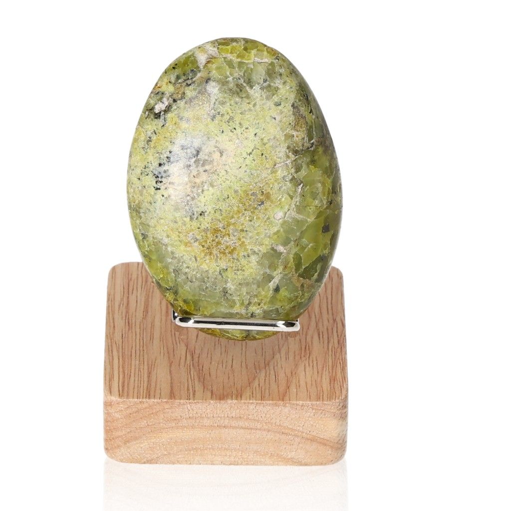 Green Opal Freeform gemstone on wooden stand for emotional balance and renewal.