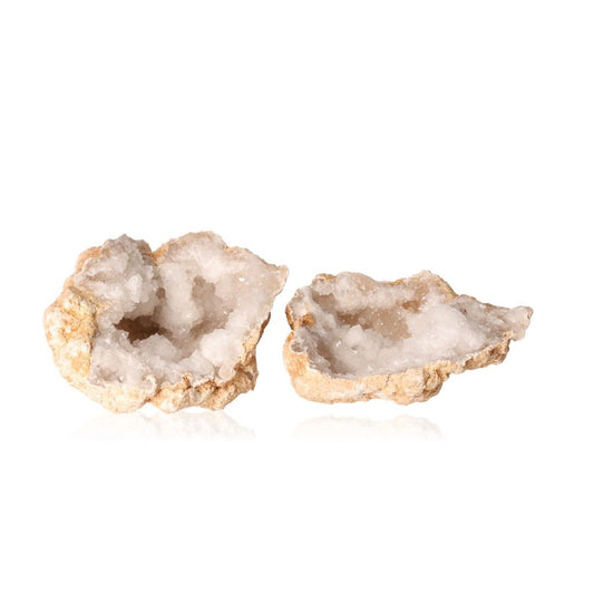 Milky quartz geode with white crystals and rugged outer shell, known for purifying energy, enhancing tranquility and clarity.