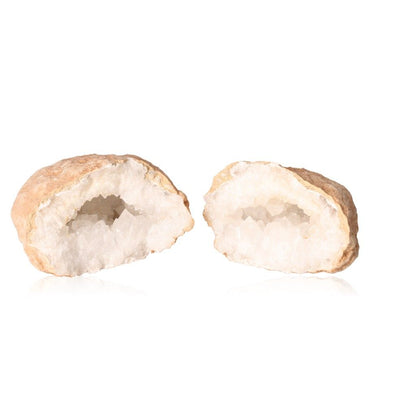 Milky quartz geode split open, revealing sparkling white crystals inside, known for purifying energy and enhancing focus.