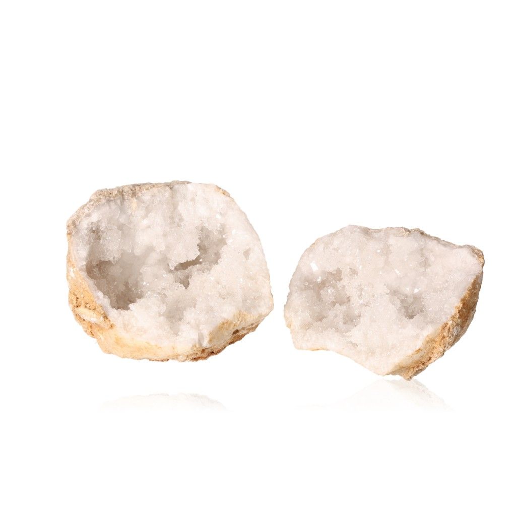 Quartz geode with milky white crystals and rugged outer shell, enhancing focus and tranquility with purifying energy.