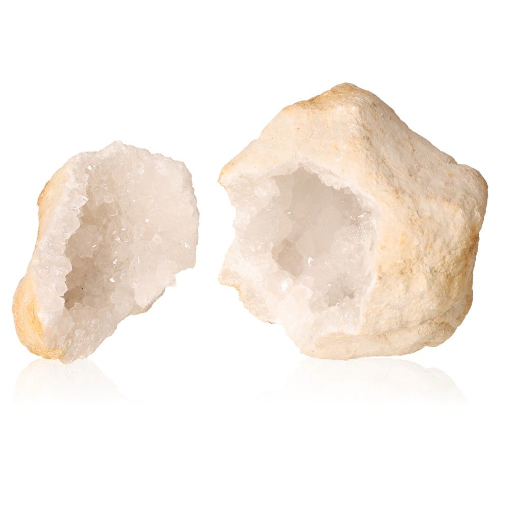 Milky quartz geode showing rugged outer shell and sparkling white crystals, ideal for energy cleansing and enhancing tranquility.