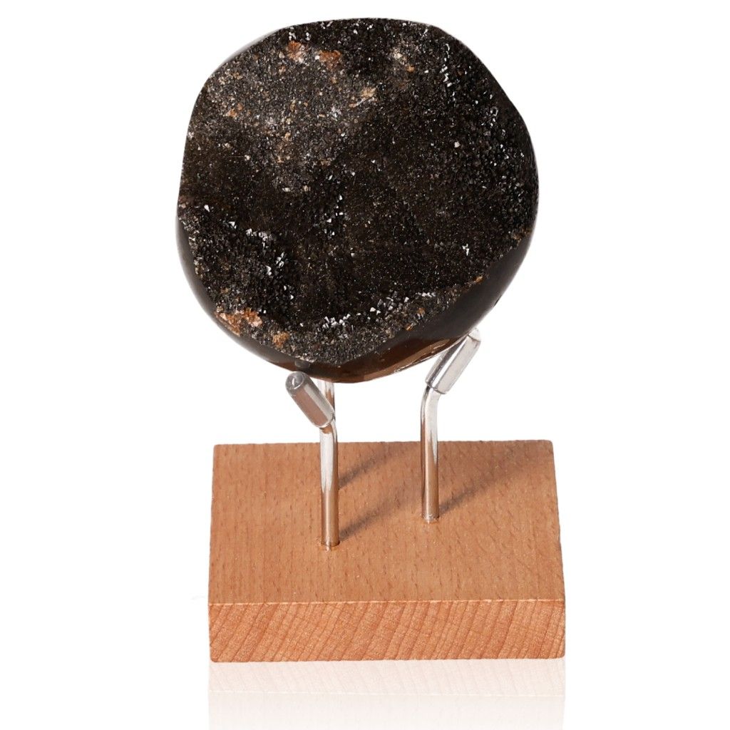 Septarian "Dragon Stone" displayed on a wooden stand, highlighting its unique mineral pattern and multidimensional properties.