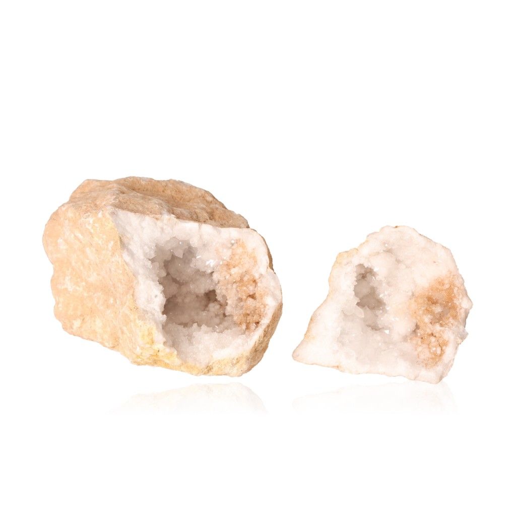 Milky quartz geode split open, showcasing sparkling cloudy white crystals, known for purifying and amplifying energy to enhance tranquility.