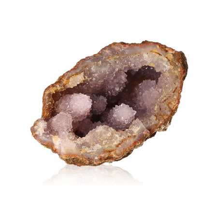 Amethyst geode showcasing purple crystal formations and rough brown exterior on a white background.