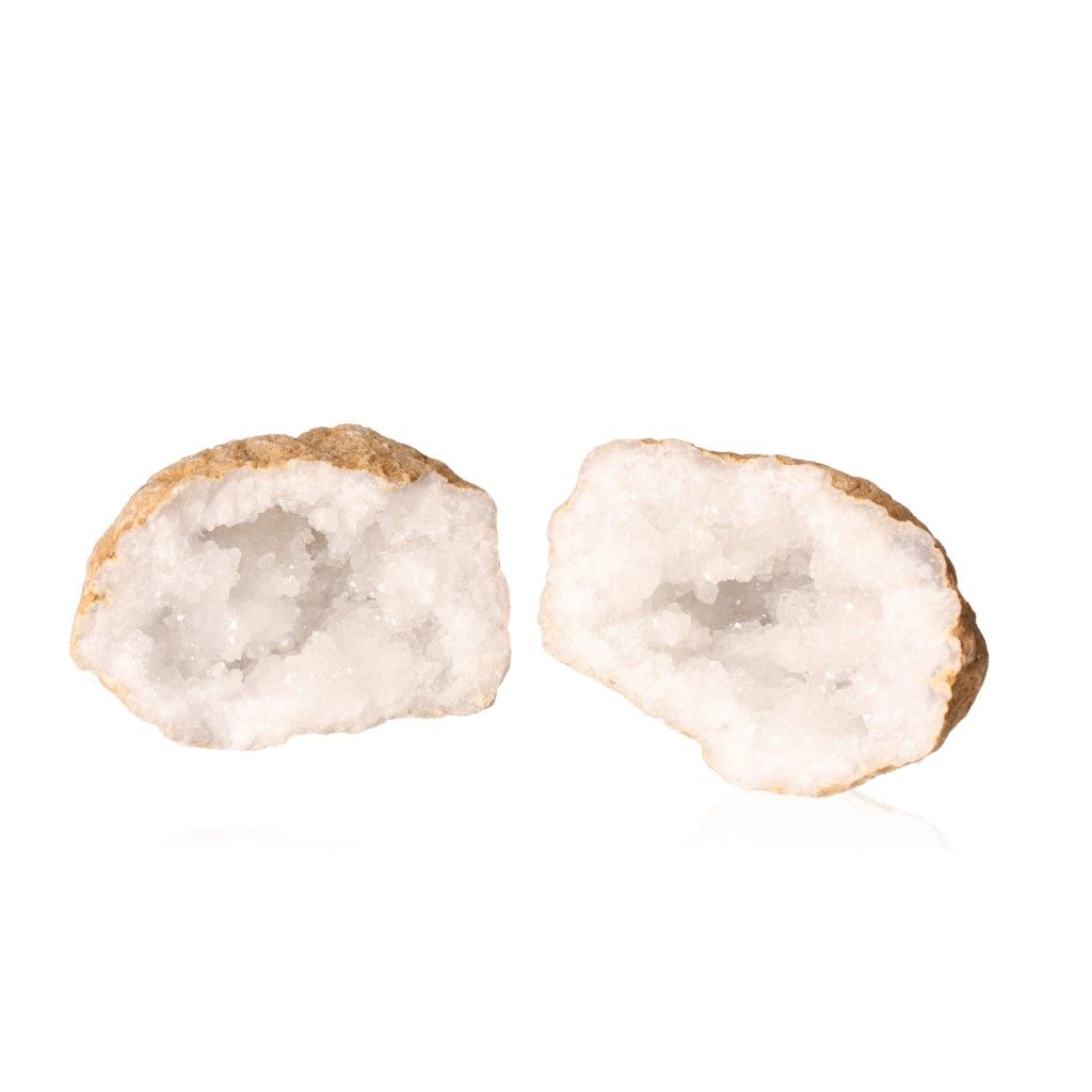 Milky quartz geode split open, revealing sparkling cloudy white crystals with a rugged outer shell, perfect for energy balance and focus.