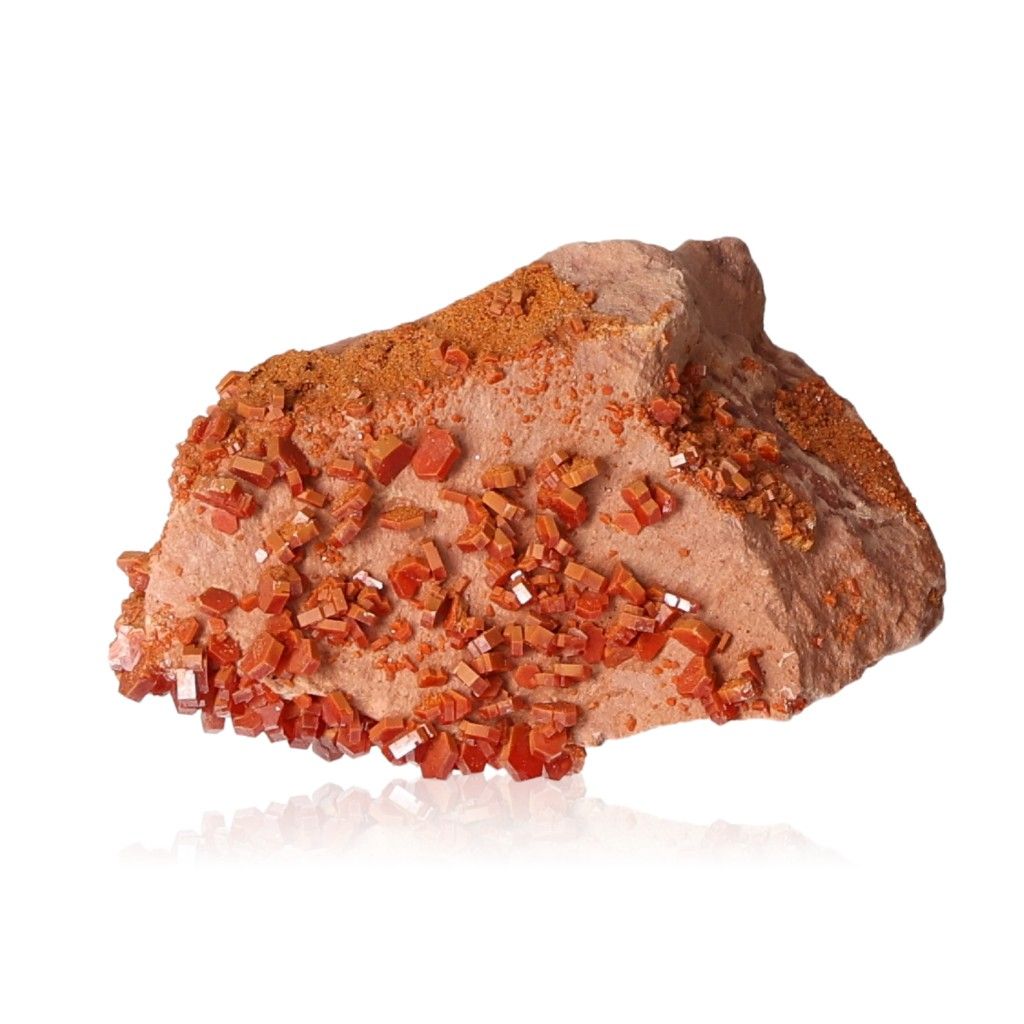 Red vanadinite crystal druze on rocky matrix for focus and motivation.