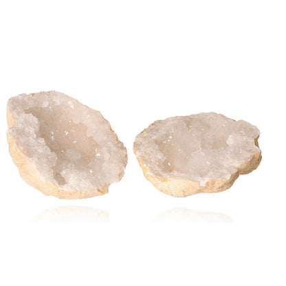 Sparkling milky quartz geode halves showcasing cloudy white crystals, ideal for purifying energy and enhancing tranquility.