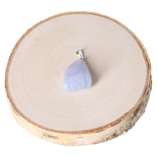 Chalcedony tumbled pendant displayed on a wooden surface.