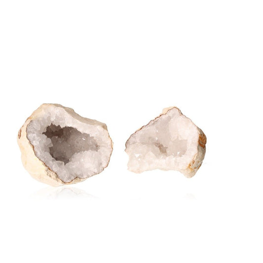 Milky quartz geode split open, displaying sparkling white crystals inside, known for purifying energy and enhancing tranquility.