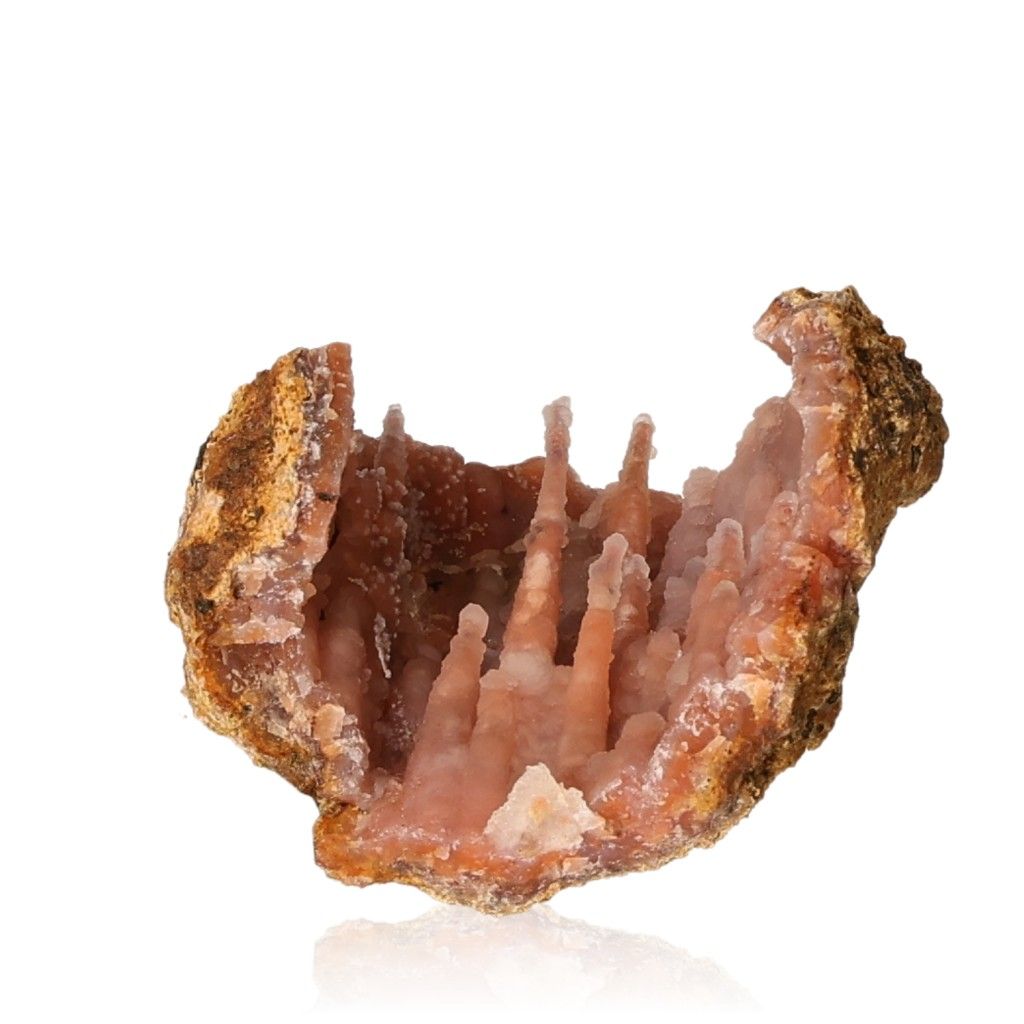 Calcite stalactite formation with intricate layers and earthy tones, symbolizing growth, energy, and natural beauty.