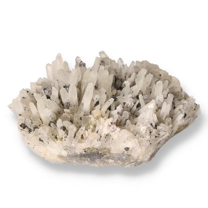 Clear quartz crystal cluster with pointed formations, known for its energy-enhancing properties and chakra association.