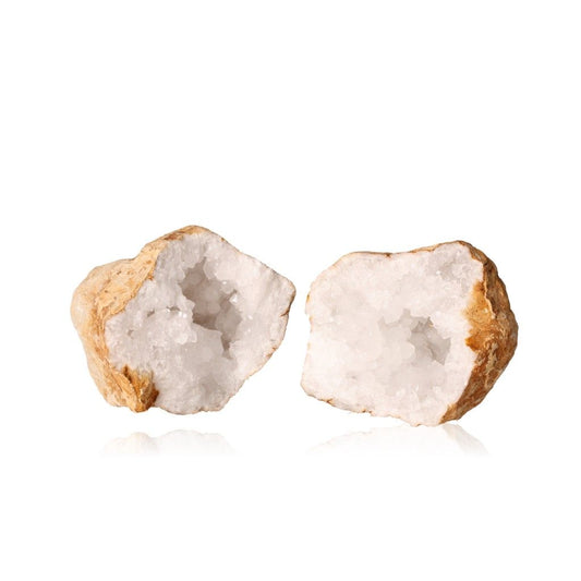 Quartz geode halves revealing sparkling milky crystals, perfect for enhancing tranquility, balance, and positive energy in any space.