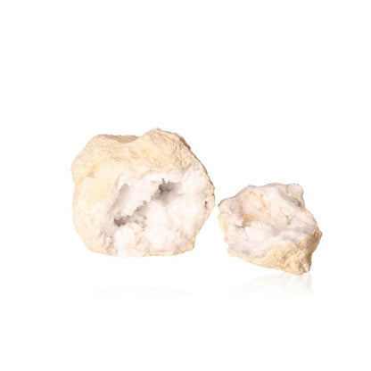 Milky quartz geode with rugged shell and sparkling white crystals, known for purifying energy and promoting tranquility.